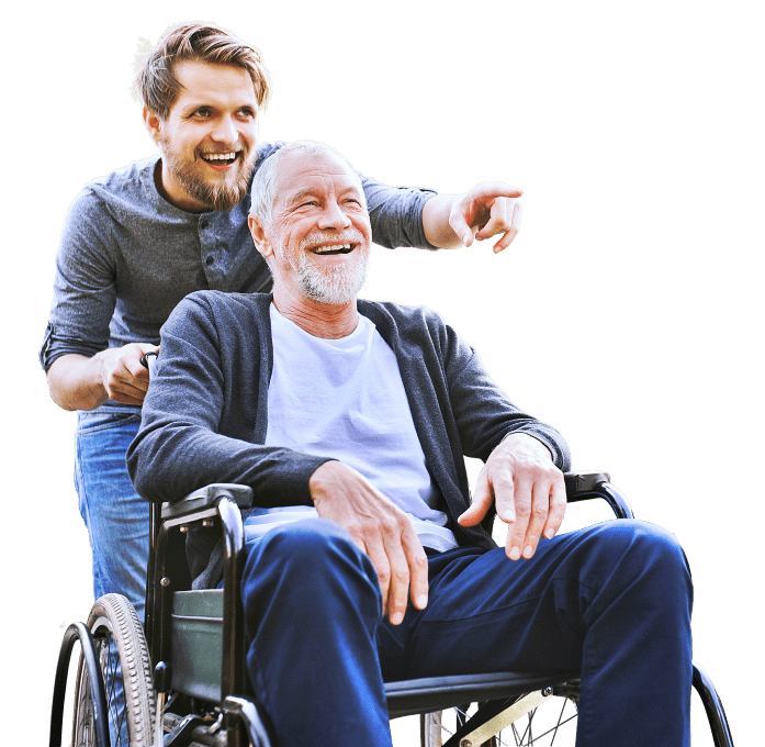 caregiver pointing ahead of the elder man on the wheelchair