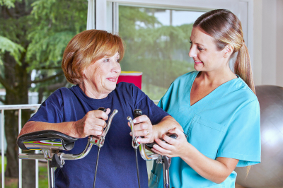 Nurse helping senior woman