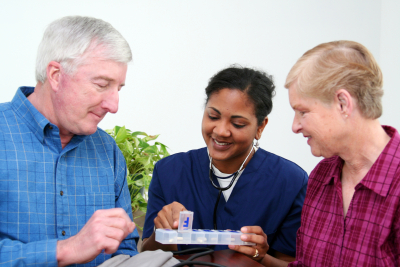 seniors with caregiver at home